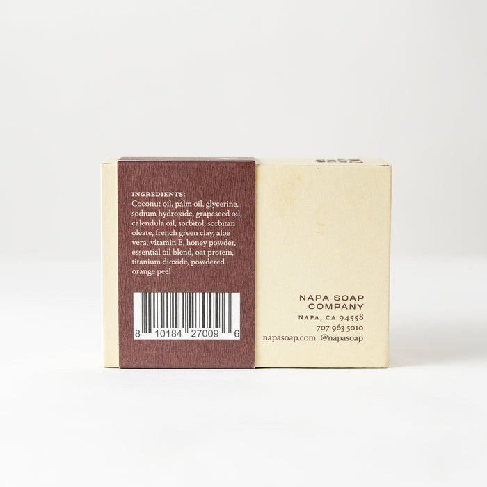 Bar of soap with a label on a white background