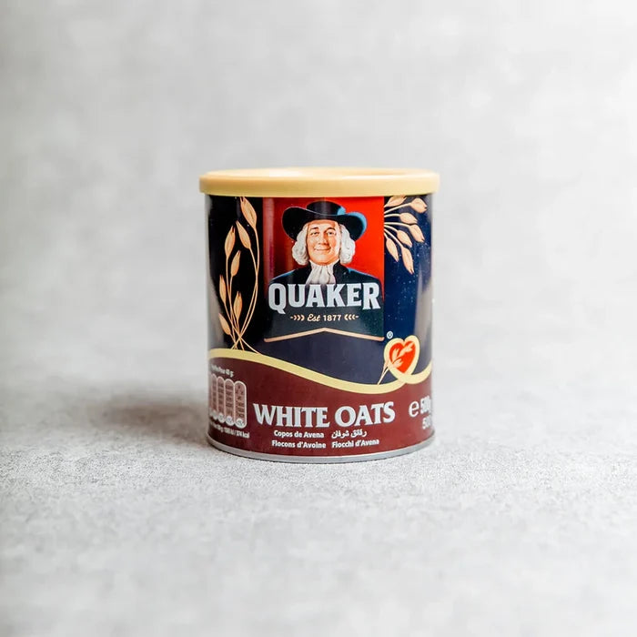 Quaker white oats container on a light gray background