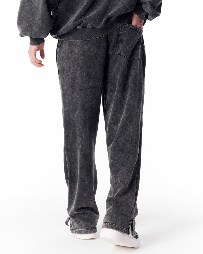 Martin Valen washed gray oversized tracksuit for men, rear view of legs and hem with sneakers partly visible