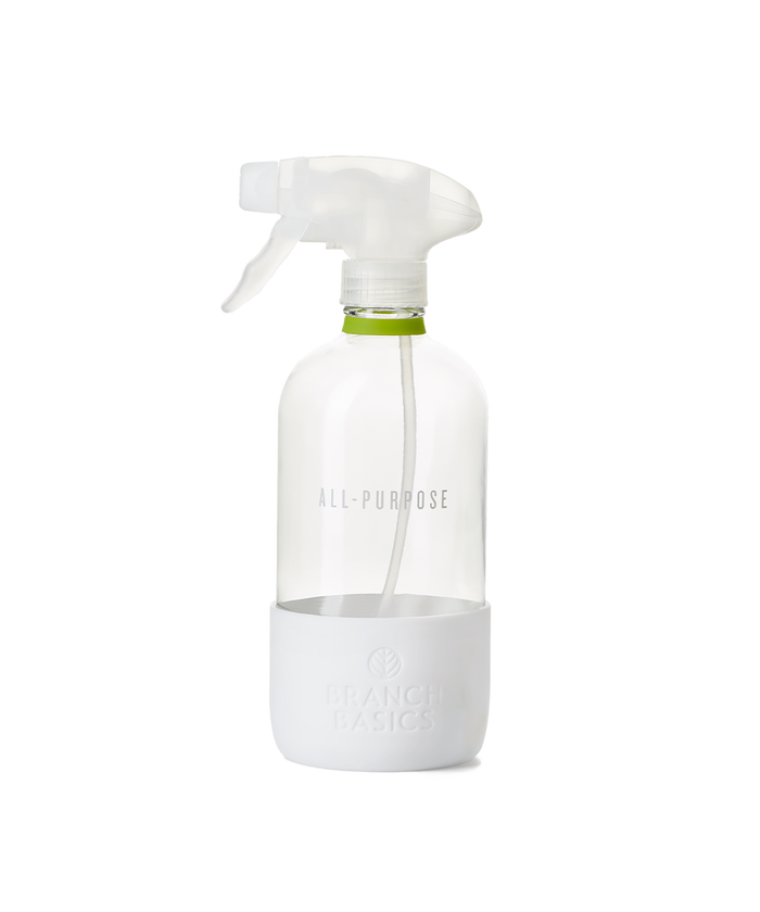 A refillable Glass All-Purpose bottle, used to dilute and dispense Branch Basics Concentrate with water, displayed on a transparent background.