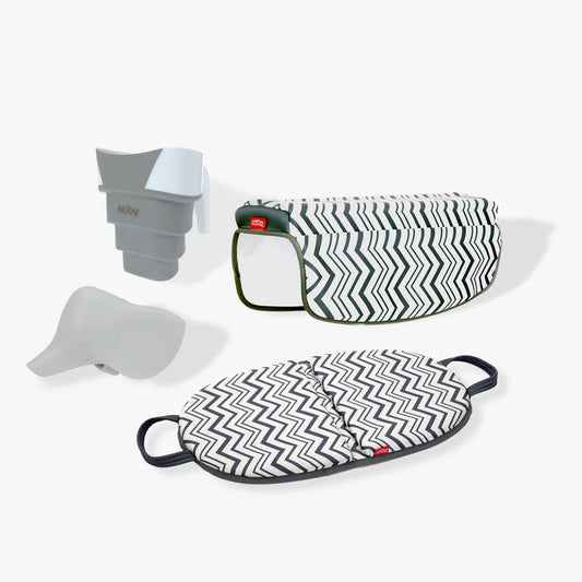 The Baby Bathtime Essentials Bundle features a safety spout guard, rinser cup, cushioned bath kneeler, and patterned arm rest—all in a chic black-and-white zigzag design.