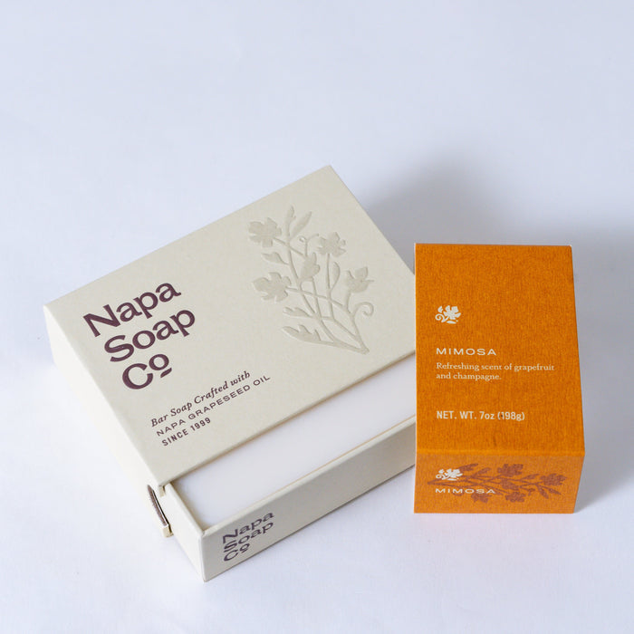 Napa Soap Co. packaging with a bar of soap and an orange box on a white background