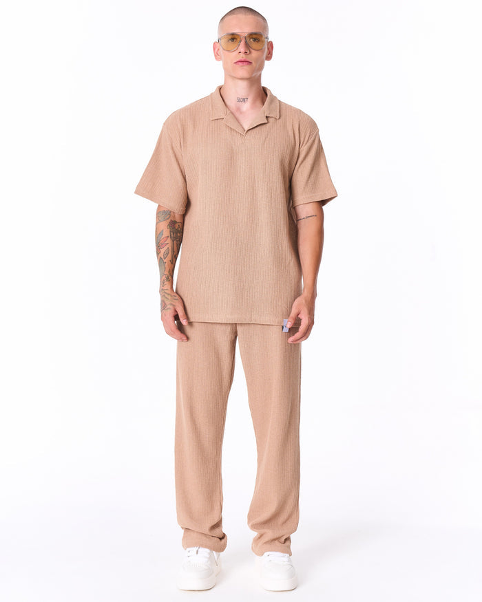 Martin Valen Breeze Fit beige men's tracksuit, front mid-body view showing short-sleeve polo top and ribbed knit texture