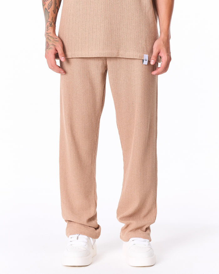 Martin Valen Breeze Fit beige tracksuit, close front view of chest showing open polo collar, short sleeves and side tag