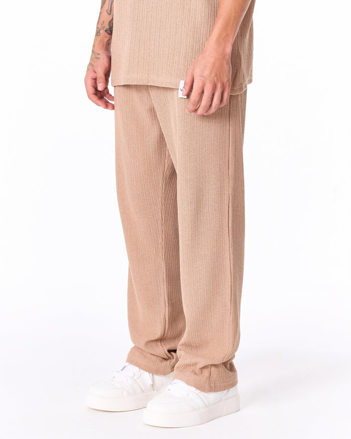 Martin Valen Breeze Fit men's beige tracksuit, close-up upper body view showing Cuban collar and yellow-tinted sunglasses
