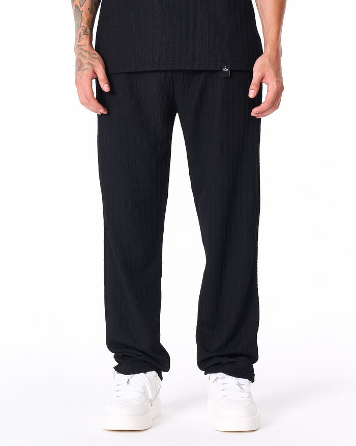Martin Valen Breeze Fit men's tracksuit in black, front waist and pants view with ribbed texture and visible brand tag