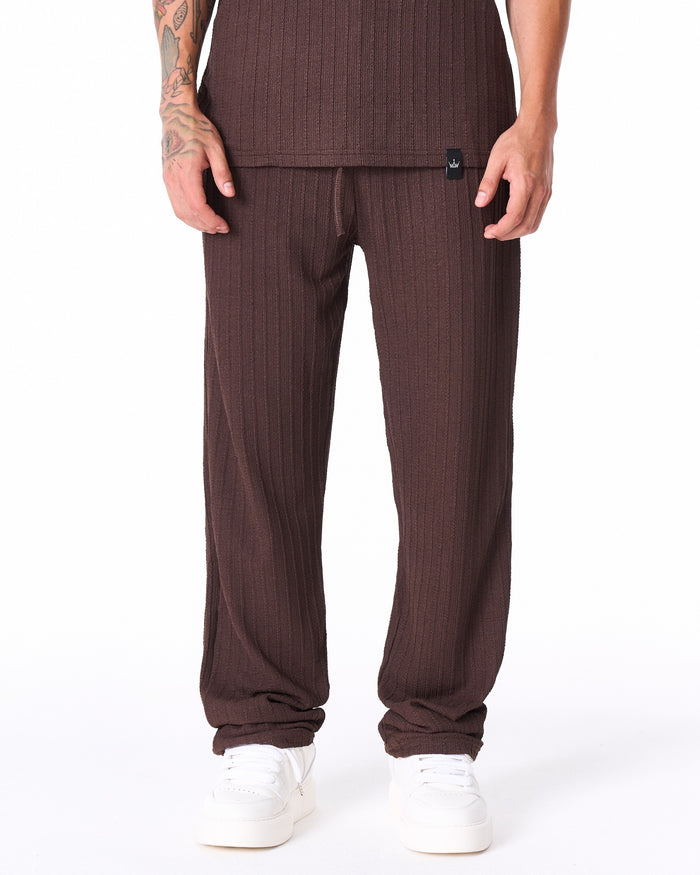 Martin Valen Breeze Fit men's tracksuit in brown, waist-level view showing black logo tab and drawstring detail