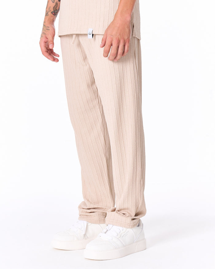 Martin Valen Breeze Fit men's tracksuit in cream, close torso view showing open collar and ribbed knit texture