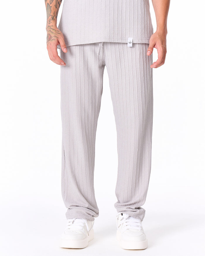 Martin Valen Breeze Fit men's gray tracksuit, mid-body view showing white label at hem of shirt and short sleeves