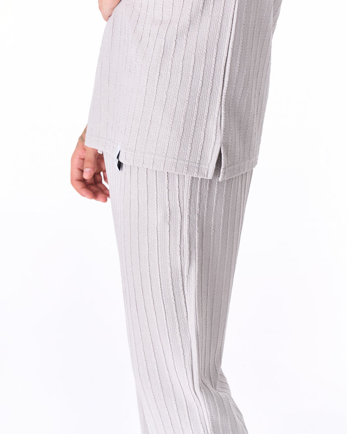 Martin Valen Breeze Fit men's tracksuit in gray, close side view showing ribbed texture and side hem slit