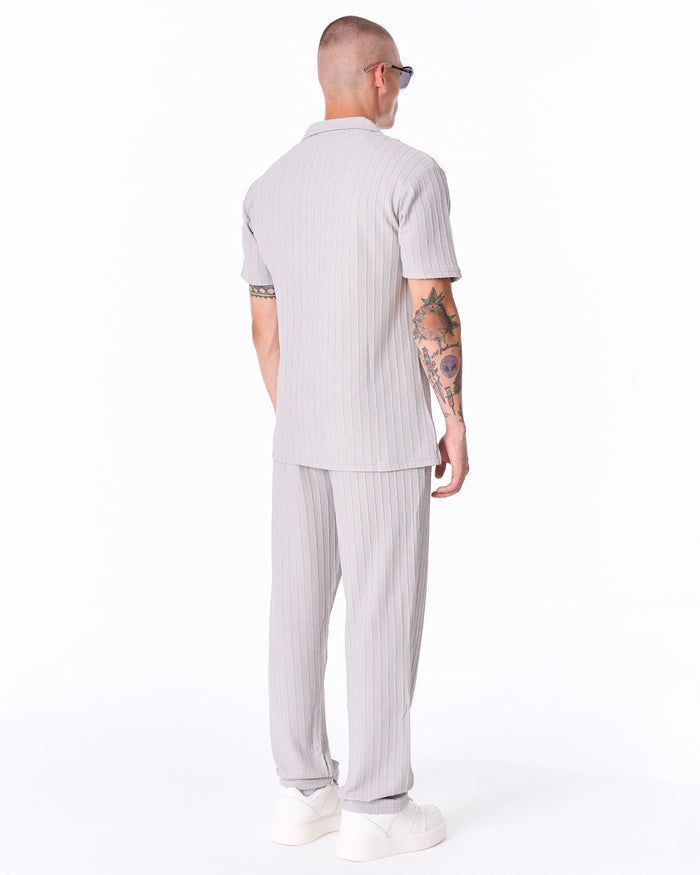 Martin Valen Breeze Fit men's tracksuit in gray, rear view showing short-sleeve polo back and ribbed knit texture