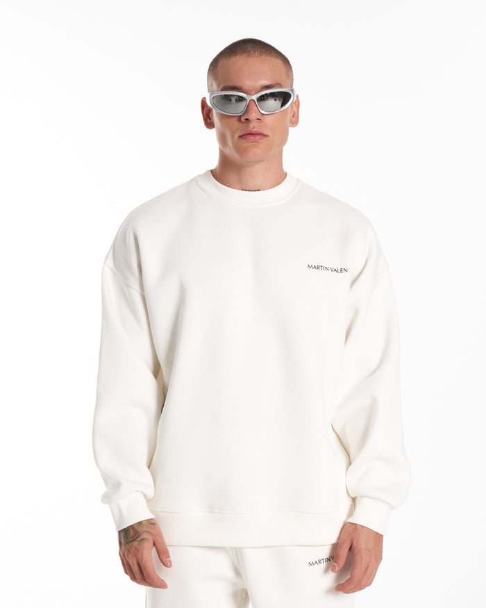 Martin Valen oversized white sweatshirt close-up from back showing centered logo and ribbed neckline detail