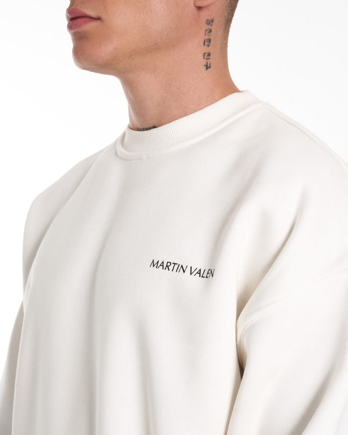 Martin Valen oversized white tracksuit full-length view showing elasticated ankle joggers and white sneakers