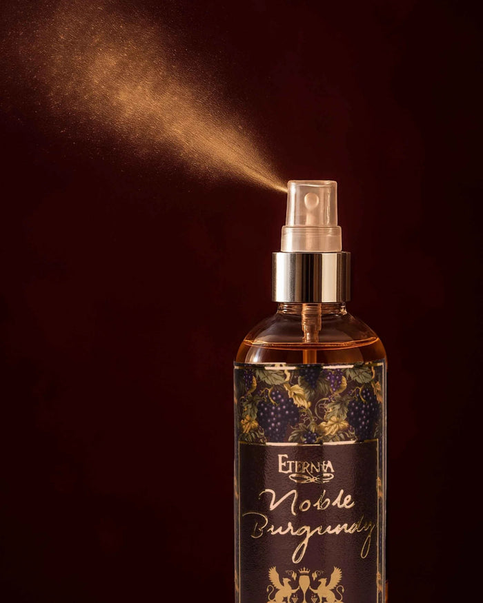 Eternia Noble Burgundy room spray bottle close-up with silver sprayer and label art.