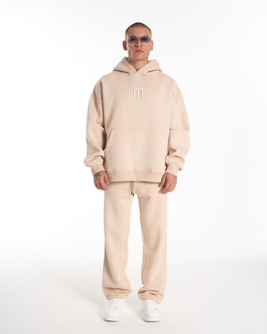Martin Valen Insignio oversized beige hoodie tracksuit front view with 3D embroidered logo and kangaroo pocket