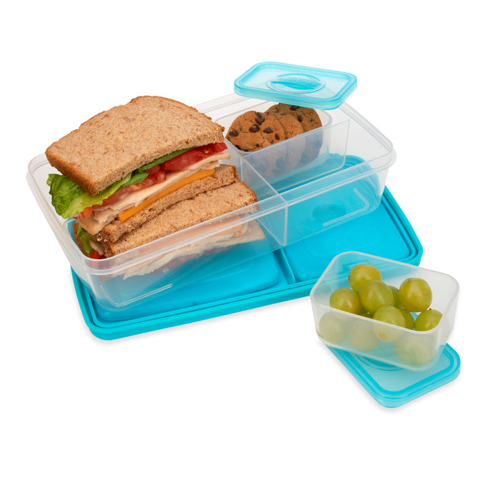 The Nuby Insulated Bento Box Lunch Box | Stars features a clear, reusable design with a blue lid, holding a sandwich, two cookies, and grapes—ideal as a kid's lunch box.