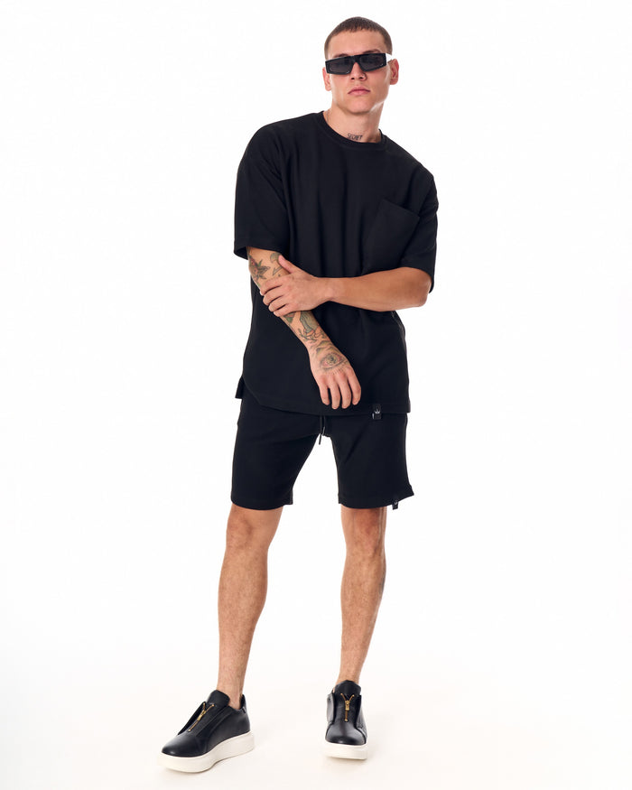 Martin Valen men's full black short tracksuit, front mid-body view showing short-sleeve top with chest pocket