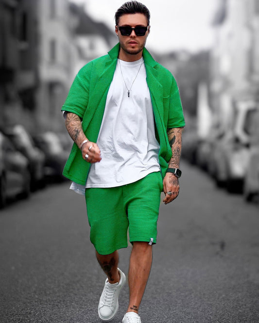 Martin Valen men's green-teal waffle tracksuit set with shorts, front walking view showing white tee and sunglasses