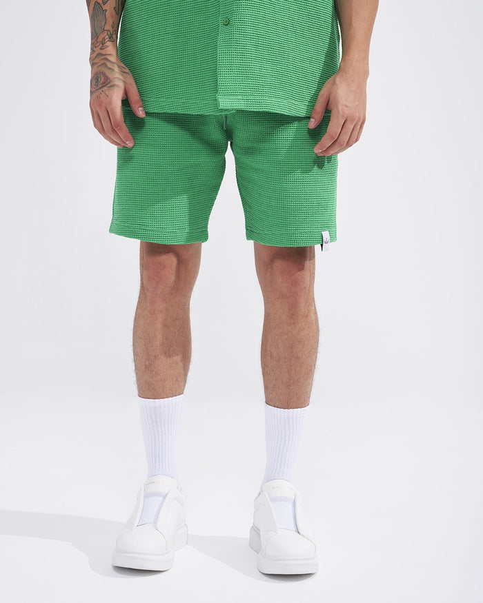 Martin Valen men's green teal waffle tracksuit with shorts, front mid-body view showing textured fabric and label