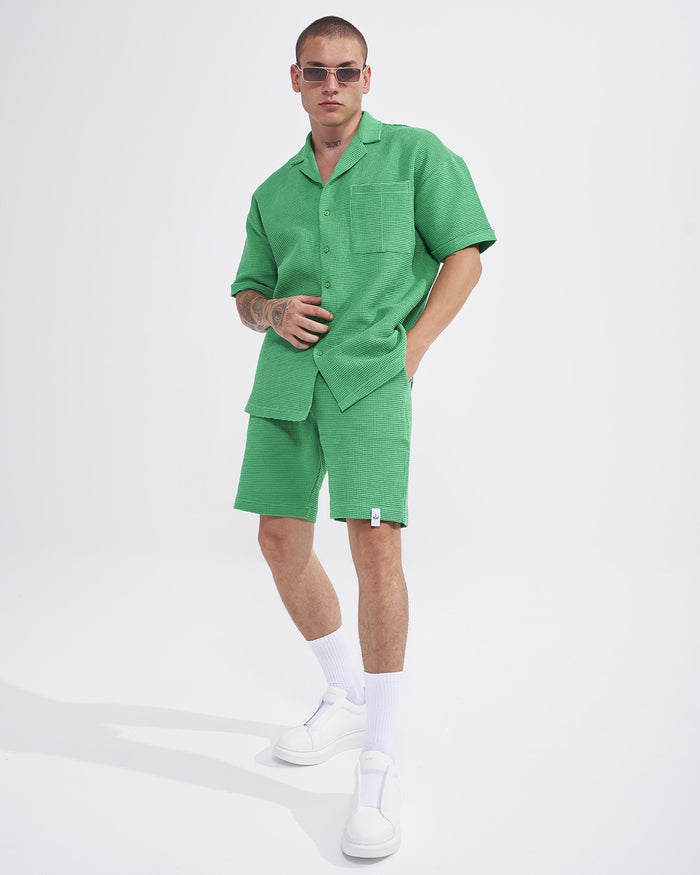 Martin Valen men's green teal waffle tracksuit, three-quarter rear view showing shirt length and short hem