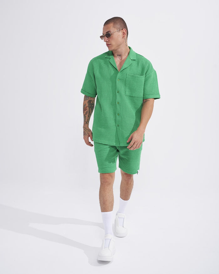 Martin Valen men’s green teal waffle tracksuit set with shorts, three-quarter front view showing short-sleeve shirt with chest pocket
