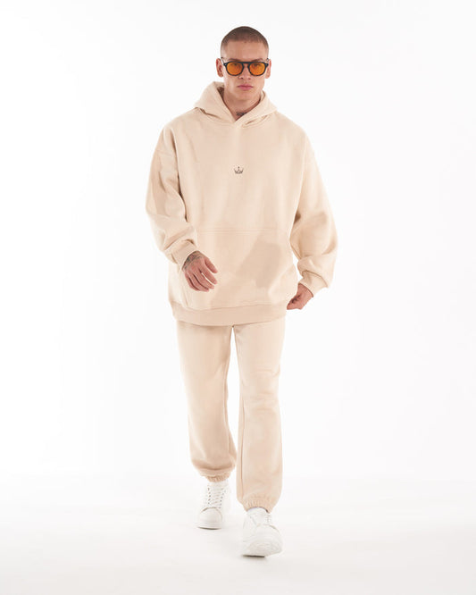 Martin Valen Regalia Crown oversized beige hoodie, front mid-body view showing small crown logo centered on chest