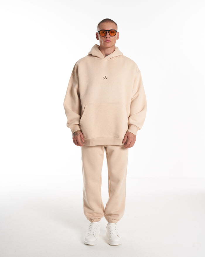 Martin Valen Regalia Crown beige hoodie, close-up of the torso showing the hood folded and kangaroo pocket