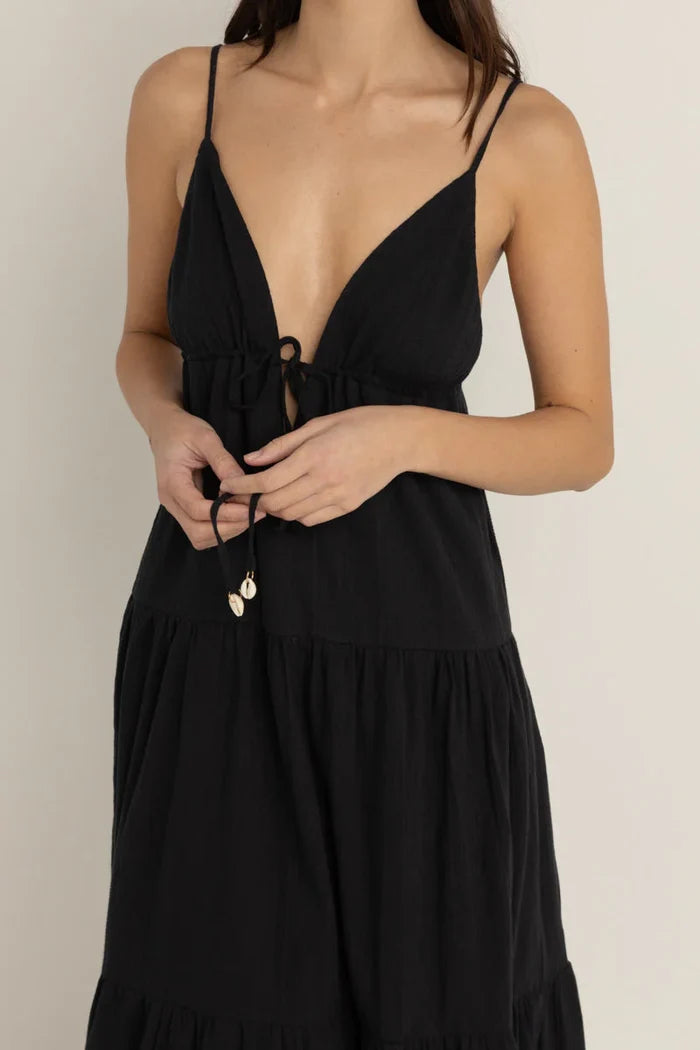 Rhythm Jaci Black dress with thin straps worn by a woman on a neutral background