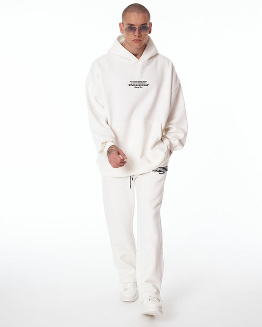 Martin Valen Rumi oversized white 3D-printed hoodie tracksuit, front view on model with small chest print