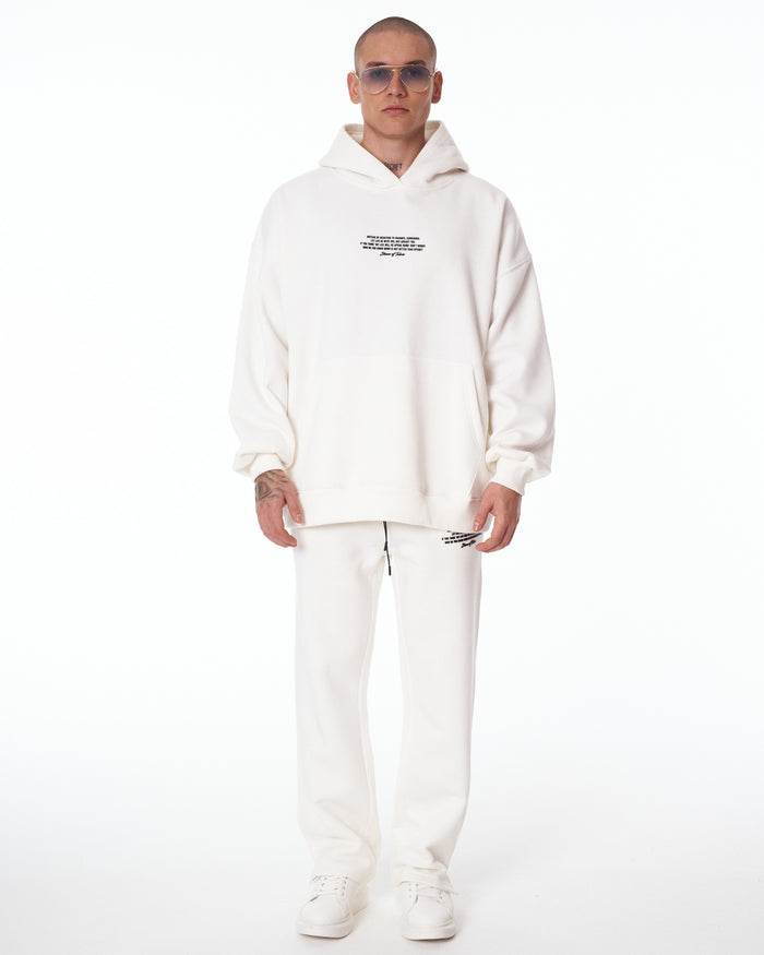 Martin Valen Rumi oversized white 3D-printed hoodie tracksuit, mid shot showing matching trousers and black drawcord
