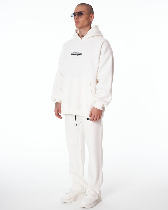 Martin Valen Rumi oversized white 3D-printed hoodie tracksuit, full-length view on model with white sneakers visible