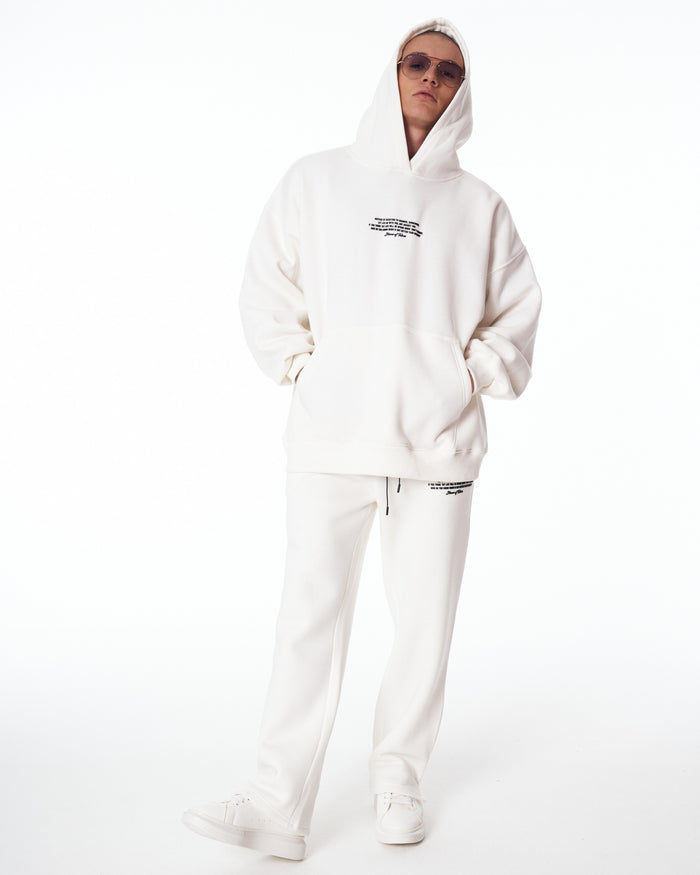 Martin Valen Rumi oversized white printed hoodie tracksuit, front mid‑body view with hood up and small black chest print