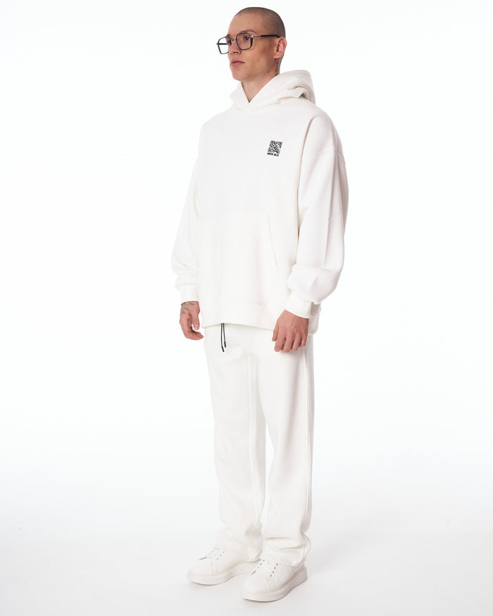 Martin Valen Sigilio oversized white hoodie shown three-quarter view from chest, small printed QR code on left chest