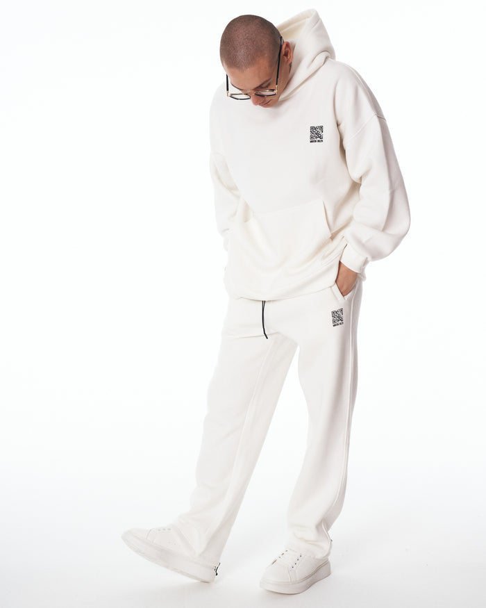 Martin Valen Sigilio white tracksuit set full-length view, model standing front showing oversized hoodie and matching joggers