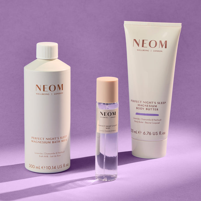 NEOM bath & body products on a purple background