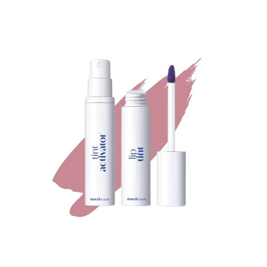Tinted Beauty Mauve Muse long-lasting lip tint in a makeup tube with applicator brush on a neutral background.