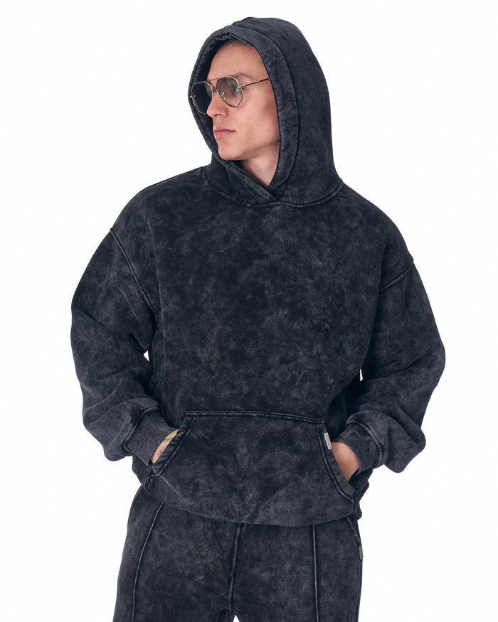 Martin Valen Urban Style washed anthracite tracksuit, mid shot three-quarter view with crossed arms and side label detail