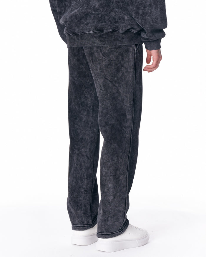 Martin Valen Urban Style washed anthracite track pants, front walking view showing leg seam and white sneakers