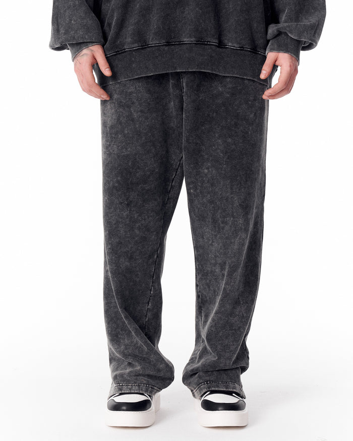 Martin Valen washed gray oversized tracksuit pants for men, rear close-up showing relaxed fit and back pocket seam